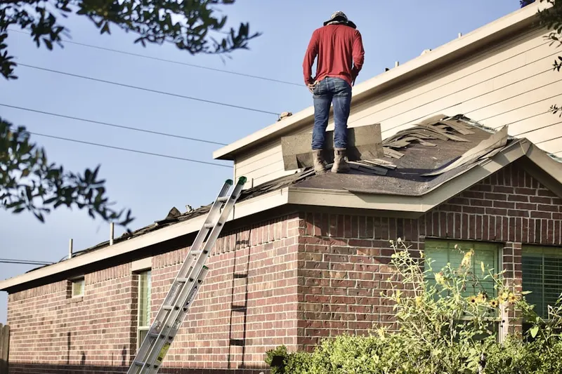 Professional roofer working on a residential roof in Centre Plaza Shopping Center